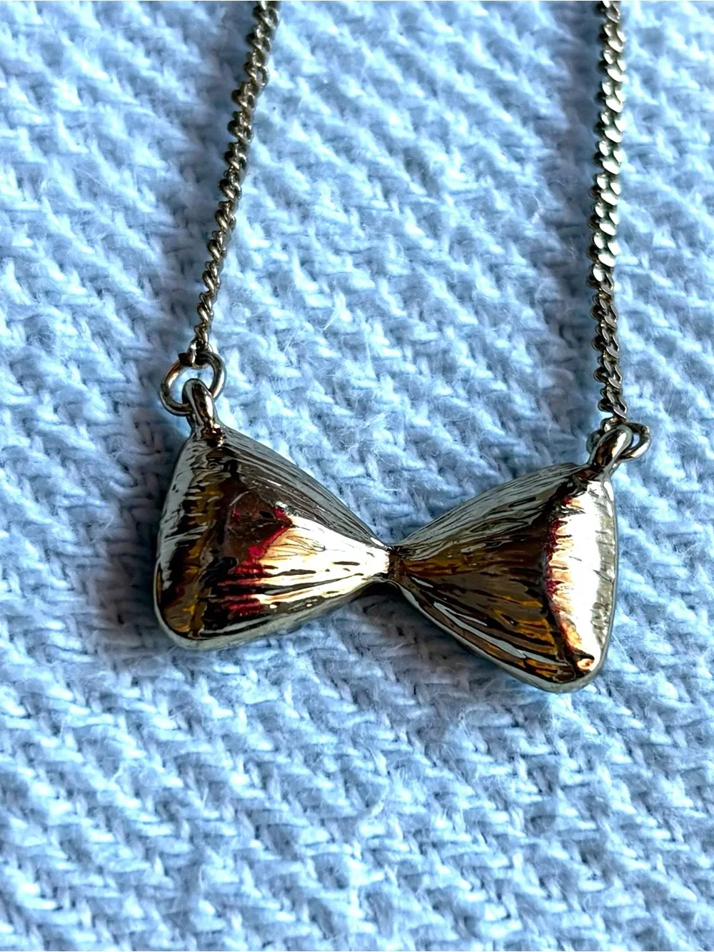 BCBGeneration Gold Holographic Vitrail Light Bow Necklace
